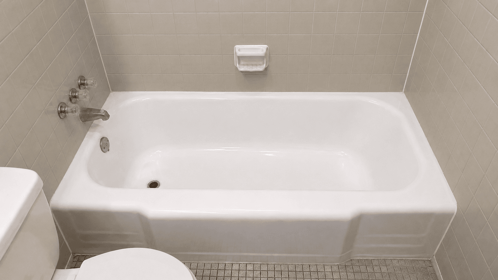 Bathtub after reglazing with bright white surface, cleaner finish, and refreshed bathroom detail