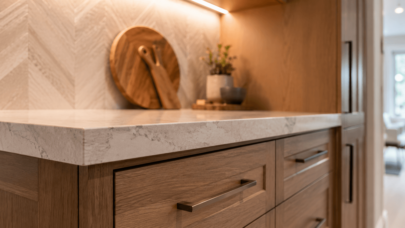 Kitchen cabinetry and countertop detail with warm wood and clean finish lines